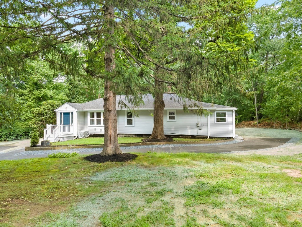 16 Chamberlain Road Shrewsbury, MA 01545 - Photo 2 of 38 a house with trees in front of it