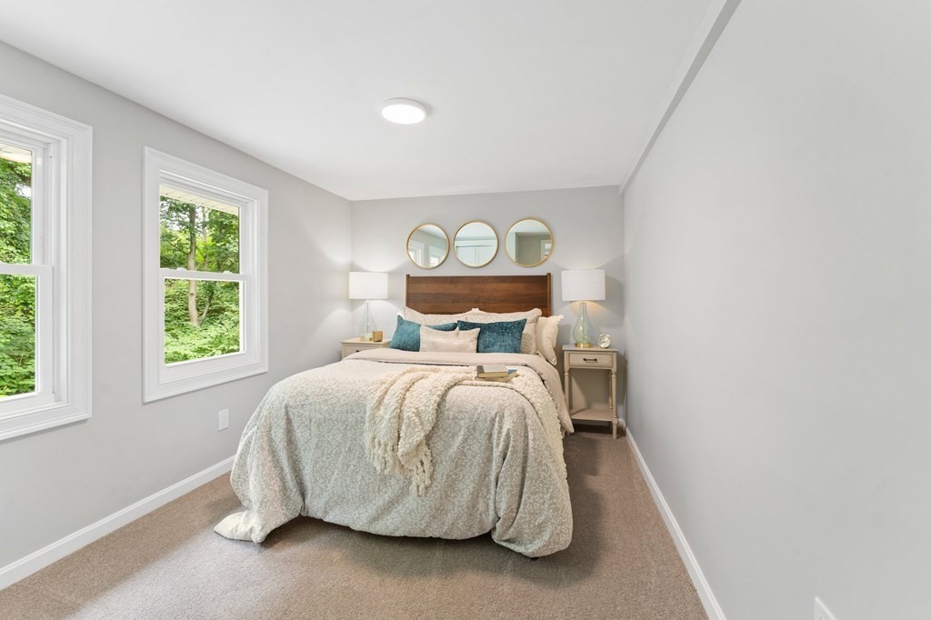 16 Chamberlain Road Shrewsbury, MA 01545 - Photo 28 of 38 a bed sitting in a bedroom next to a window