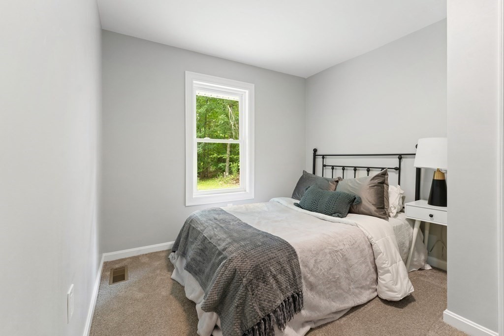 16 Chamberlain Road Shrewsbury, MA 01545 - Photo 31 of 38 a bedroom with a bed and a window