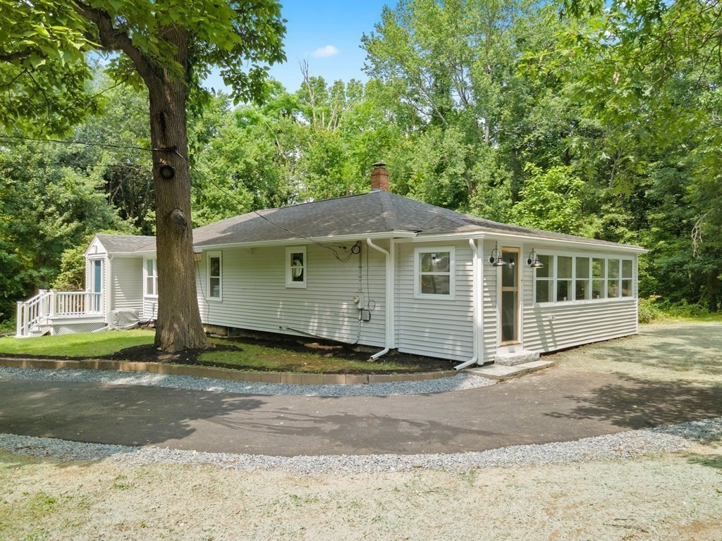 16 Chamberlain Road Shrewsbury, MA 01545 - Photo 34 of 38 a front view of a house with a garden