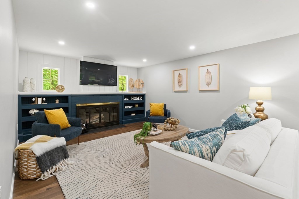 16 Chamberlain Road Shrewsbury, MA 01545 - Photo 7 of 38 a living room with furniture and a couch