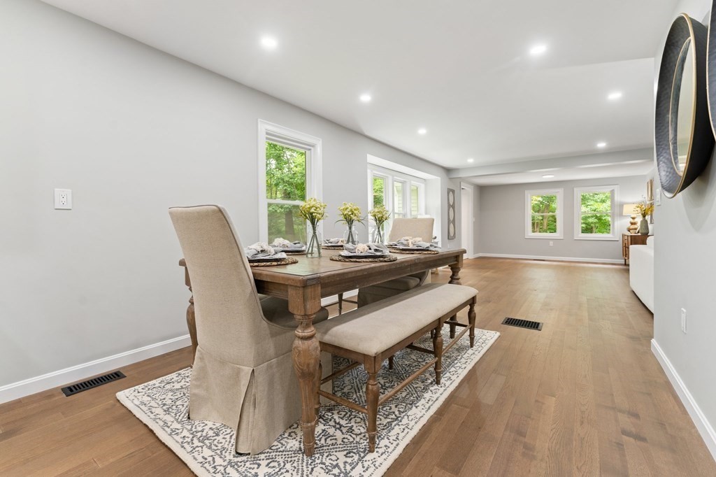 16 Chamberlain Road Shrewsbury, MA 01545 - Photo 10 of 38 a living room with a couch and a table