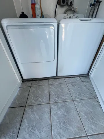 a utility room with dryer and washer
