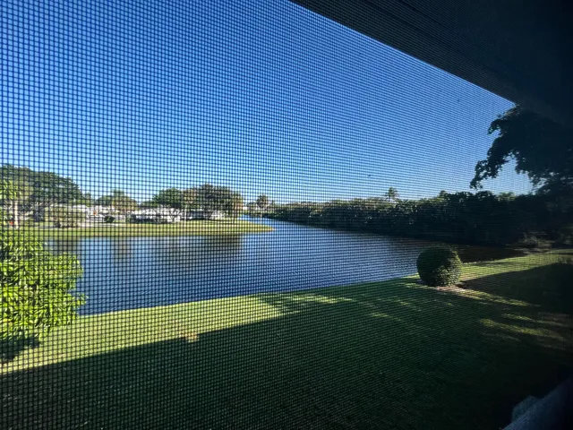 a view of a lake with a yard