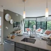 a kitchen with a sink and a large window
