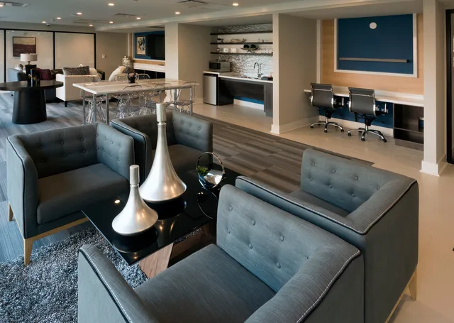 a kitchen with stainless steel appliances kitchen island granite countertop a sink and cabinets