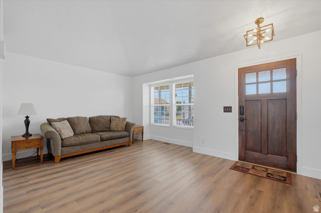 5576 South 4100th Street West Roy, UT 84067 - Photo 5 of 35 Fresh paint and LVP flooring living room and front door