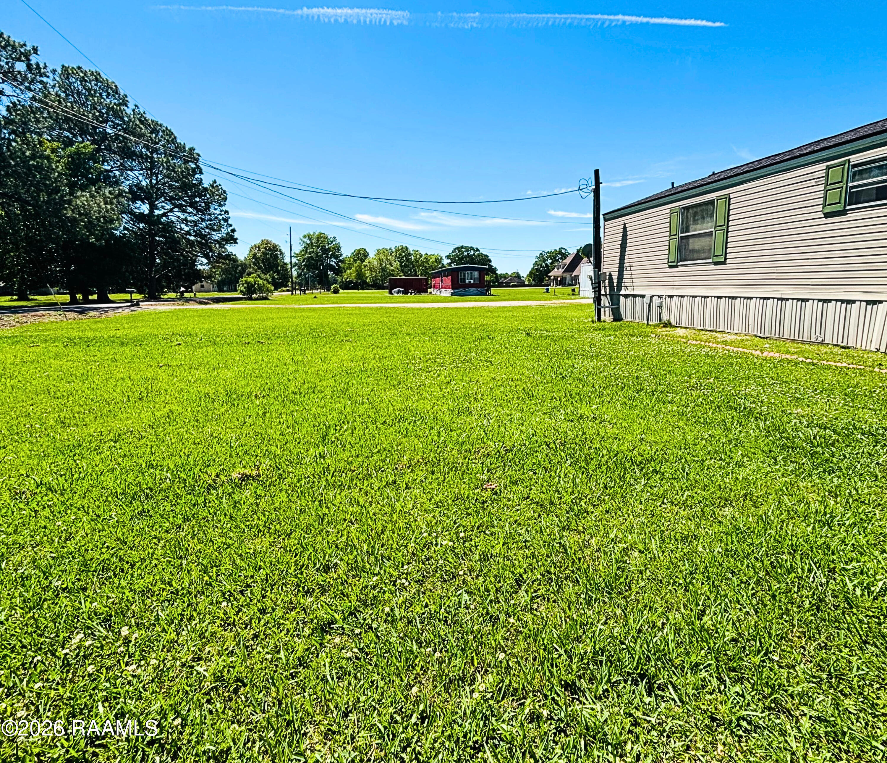 104 Gourmet Road Carencro, LA 70520 - Photo 3 of 13 Left side yard - Edited