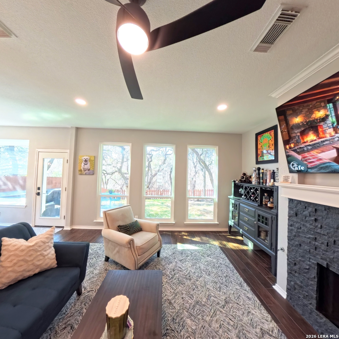 20115 Standish Road San Antonio, TX 78258 - Photo 11 of 51 a living room with furniture and a flat screen tv