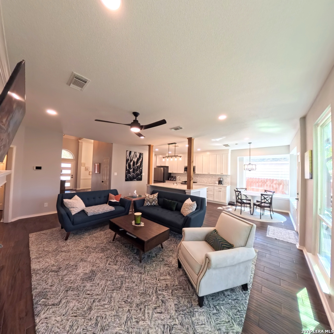 20115 Standish Road San Antonio, TX 78258 - Photo 12 of 51 a living room with furniture and a large window