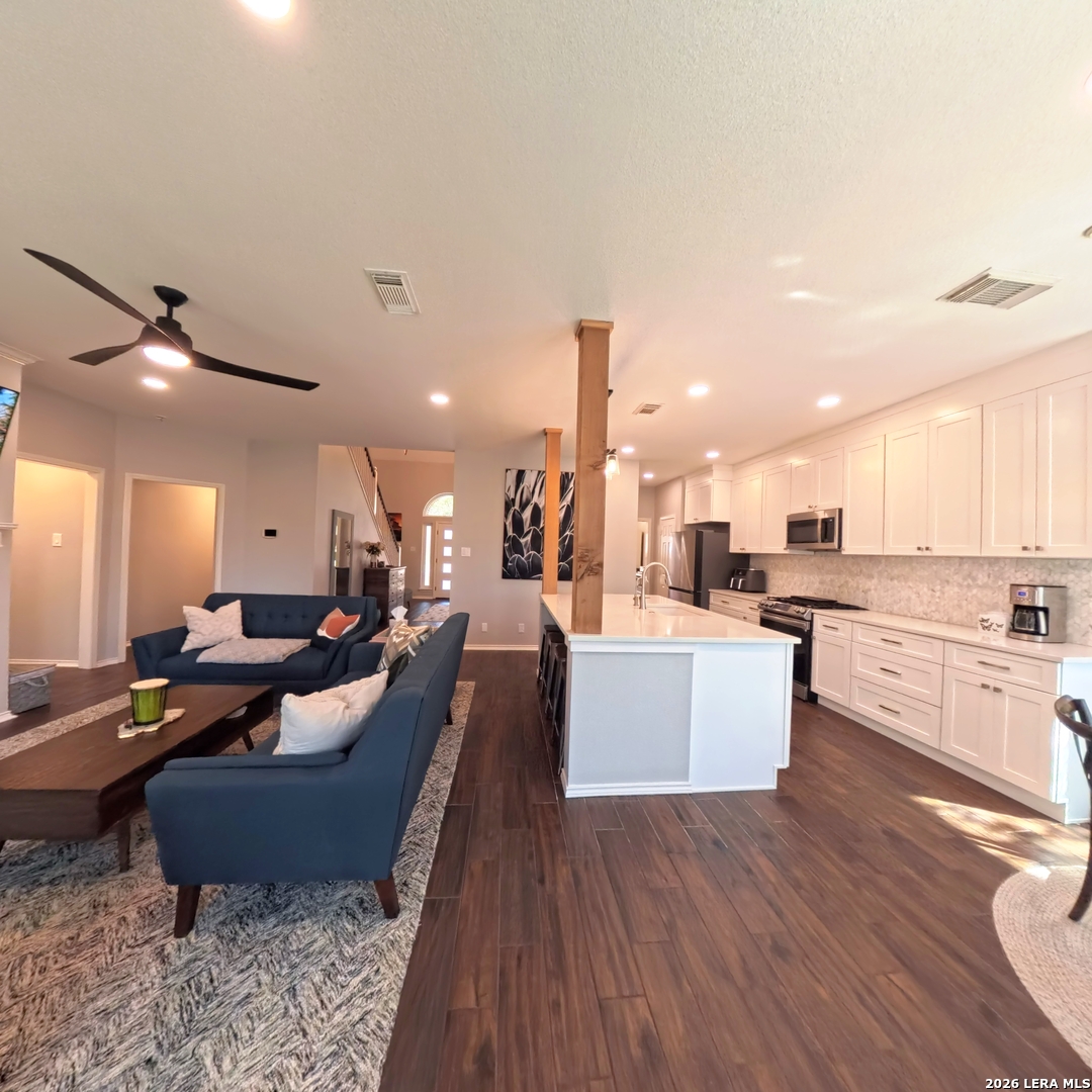 20115 Standish Road San Antonio, TX 78258 - Photo 13 of 51 a large living room with stainless steel appliances kitchen island granite countertop a couch and a view of living room