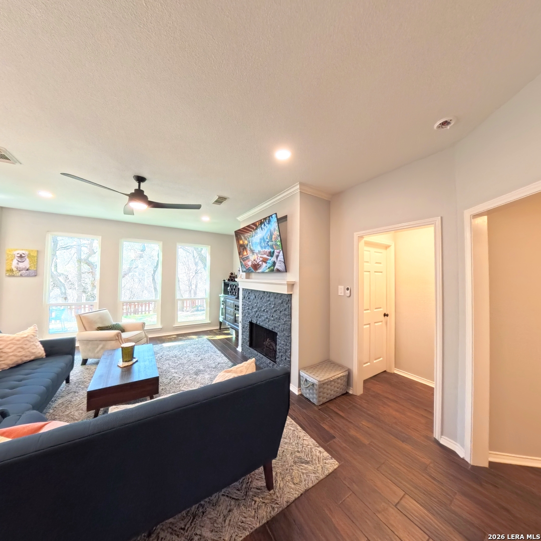 20115 Standish Road San Antonio, TX 78258 - Photo 16 of 51 a living room with furniture and a fireplace