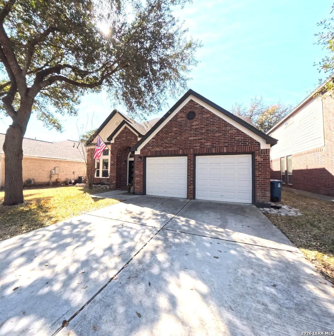 20115 Standish Road San Antonio, TX 78258 - Photo 2 of 51 a view of a house with a yard and large tree
