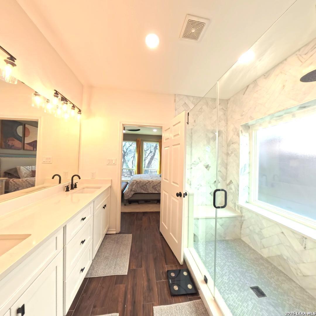 20115 Standish Road San Antonio, TX 78258 - Photo 25 of 51 a spacious bathroom with a tub shower and sink