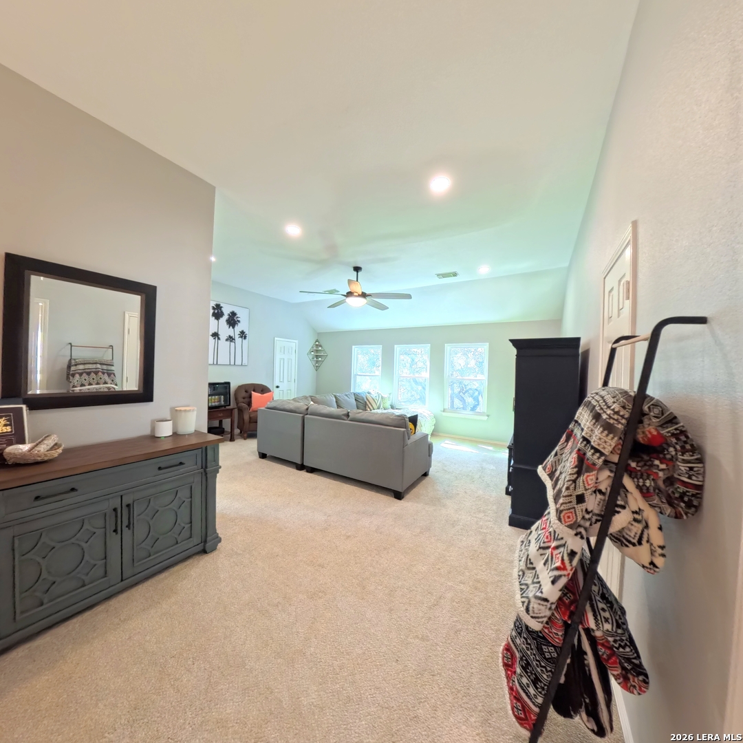 20115 Standish Road San Antonio, TX 78258 - Photo 28 of 51 a living room with furniture and a flat screen tv