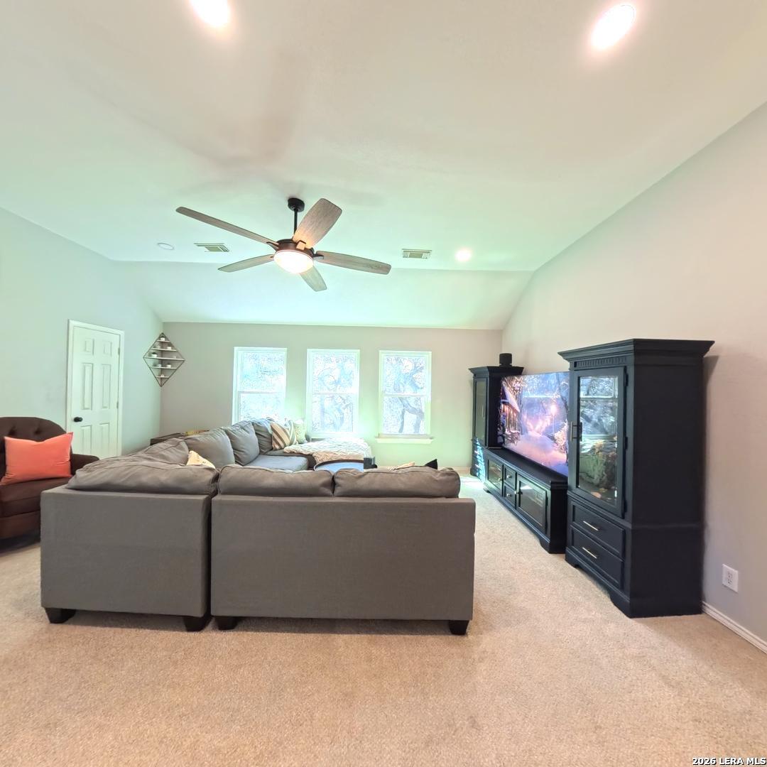 20115 Standish Road San Antonio, TX 78258 - Photo 29 of 51 a living room with furniture and a flat screen tv