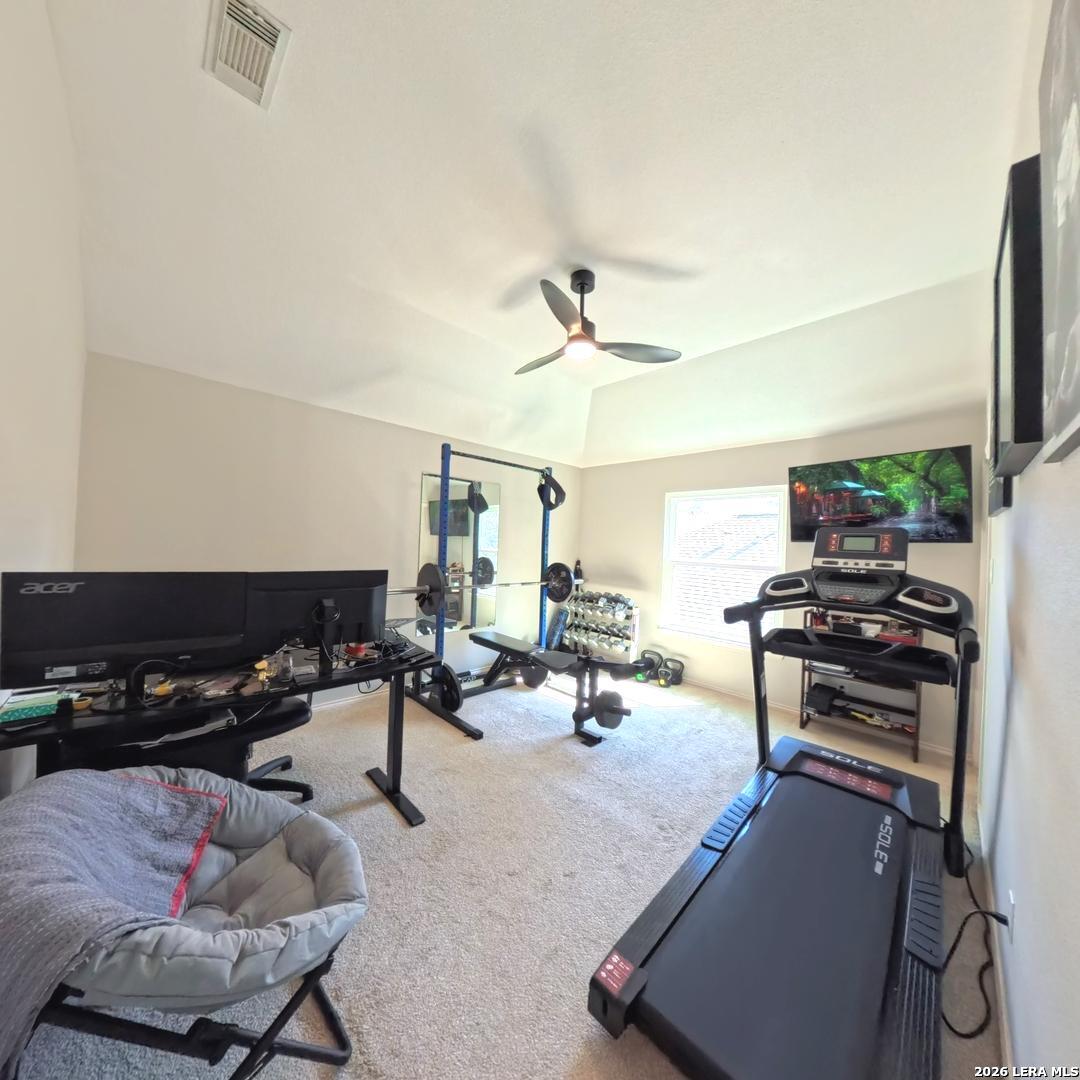 20115 Standish Road San Antonio, TX 78258 - Photo 34 of 51 a living room with furniture a flat screen tv and a window