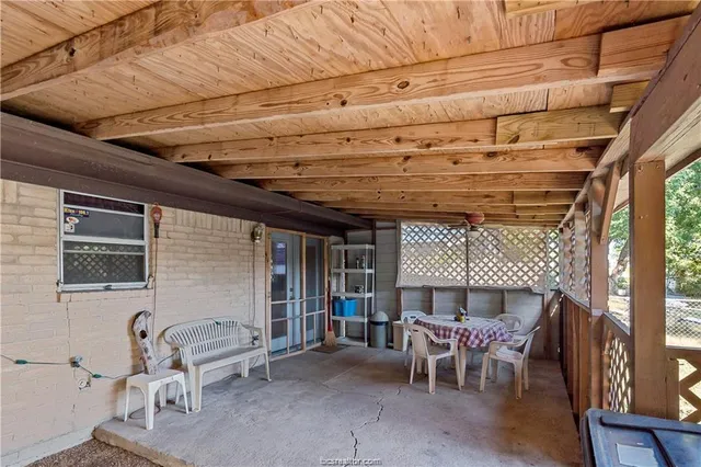 a front view of a house with outdoor seating