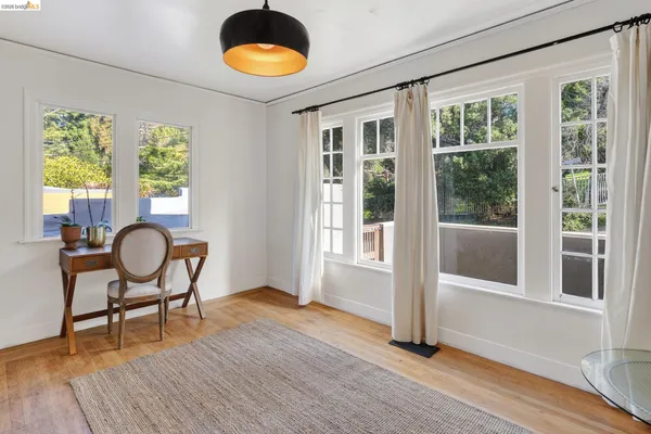 a view of a room with furniture window and wooden floor
