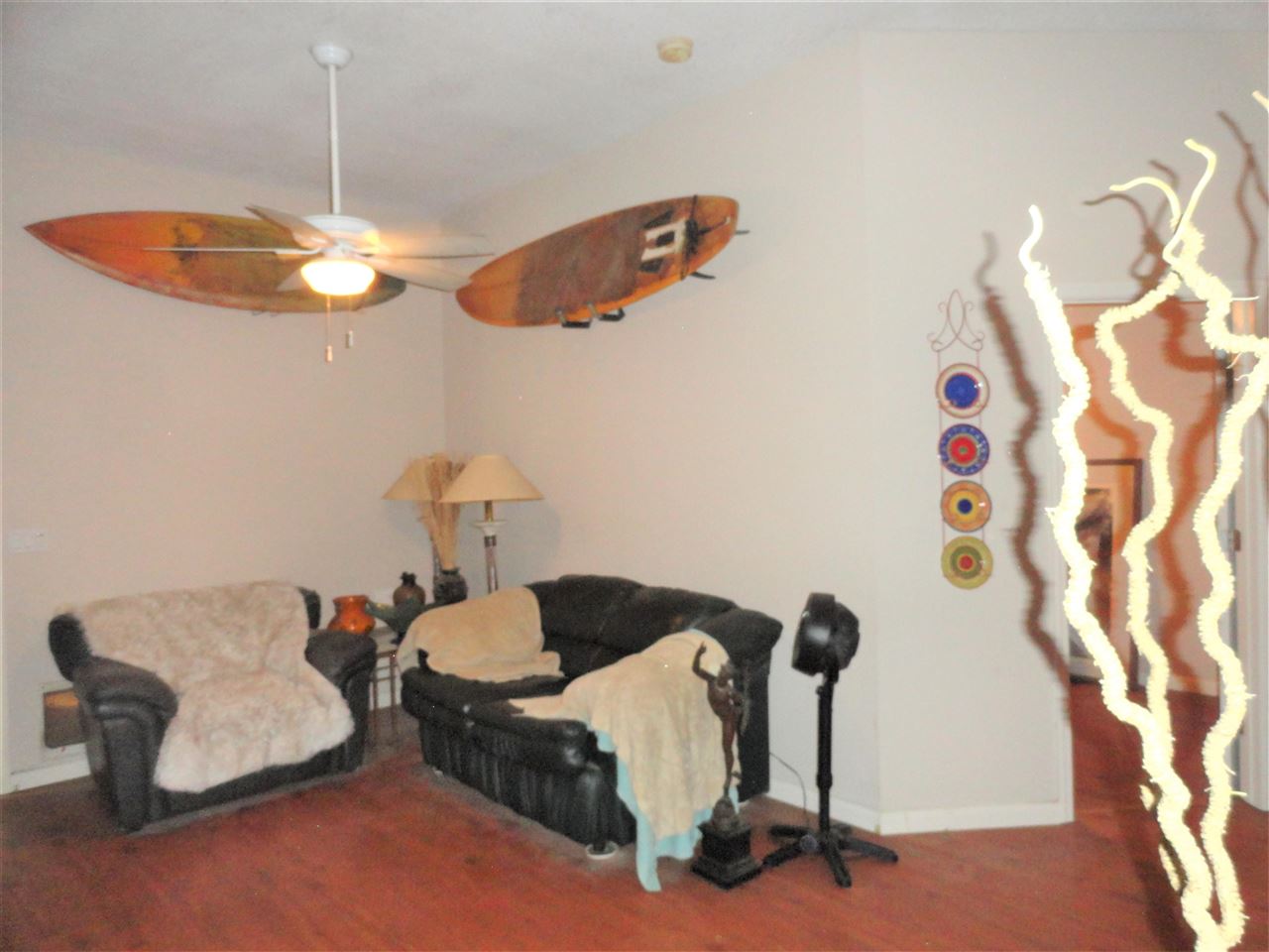 1340 Kings Estate Road St. Augustine, FL 32086 - Photo 12 of 40 a bedroom with a bed and a chandelier