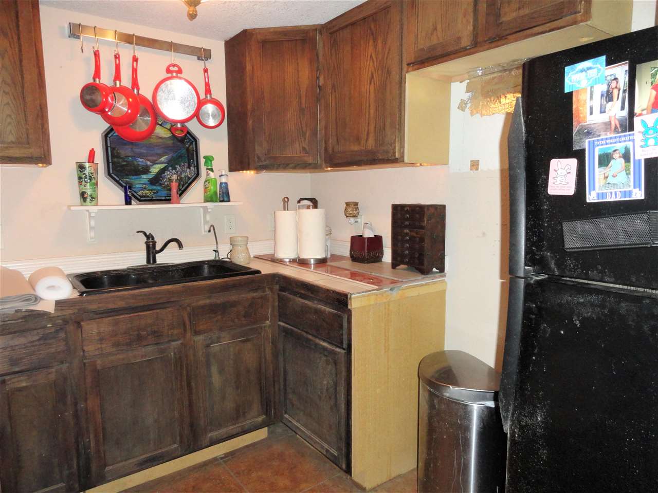 1340 Kings Estate Road St. Augustine, FL 32086 - Photo 14 of 40 a kitchen with a sink cabinets and a stove top oven
