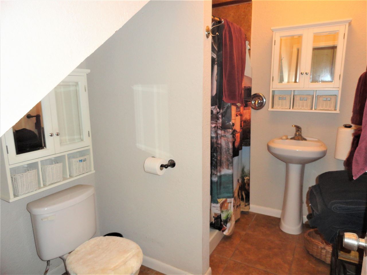 1340 Kings Estate Road St. Augustine, FL 32086 - Photo 17 of 40 a bathroom with a toilet sink and mirror