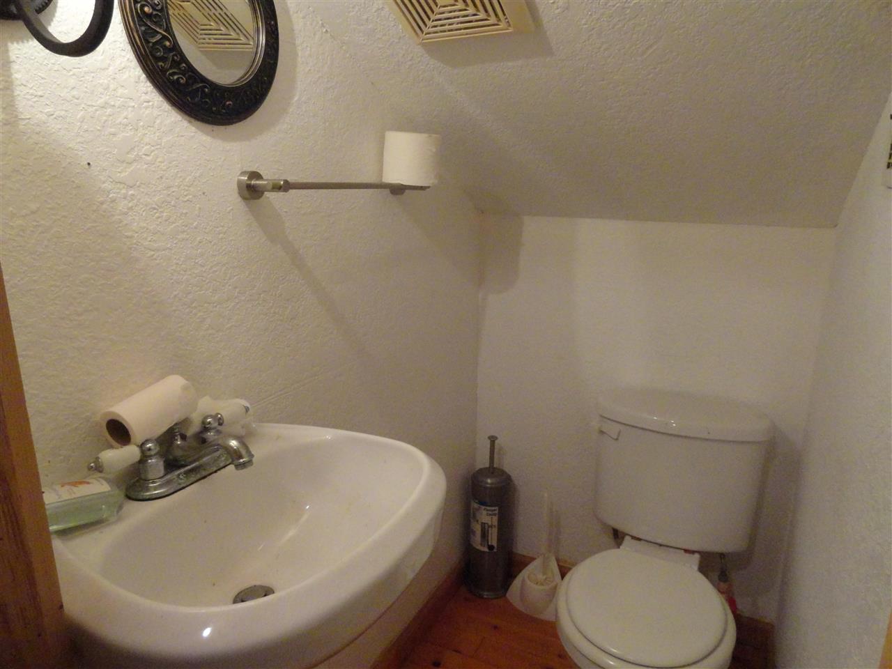 1340 Kings Estate Road St. Augustine, FL 32086 - Photo 19 of 40 a bathroom with a sink a toilet and a mirror