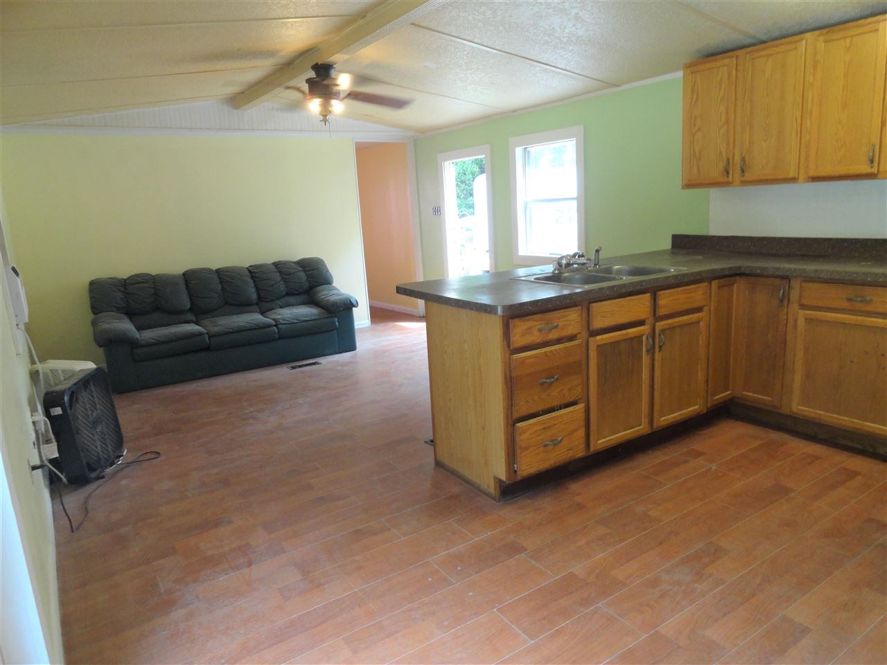 1340 Kings Estate Road St. Augustine, FL 32086 - Photo 27 of 40 a living room with kitchen island granite countertop furniture a sink a window and stainless steel appliances