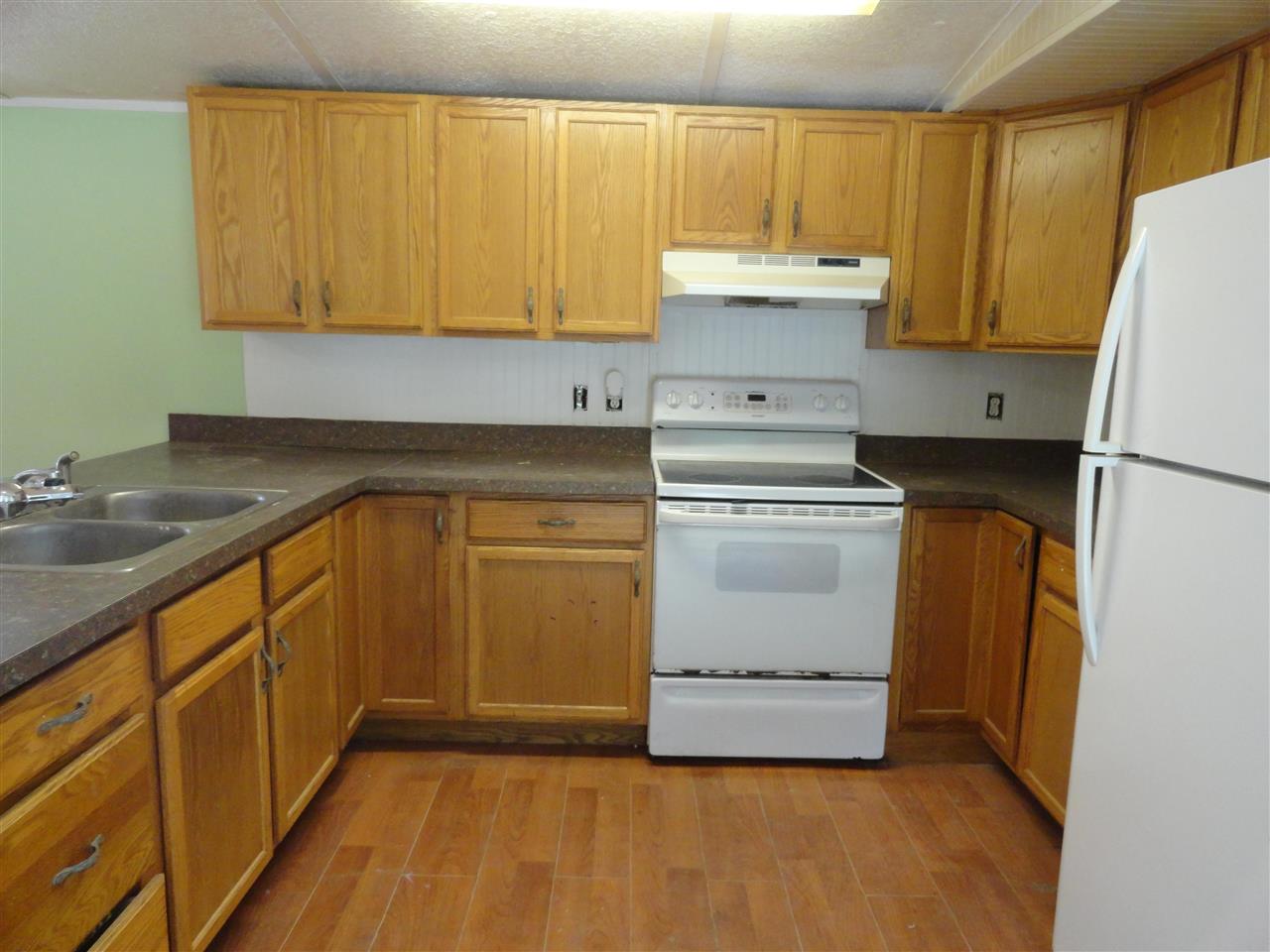 1340 Kings Estate Road St. Augustine, FL 32086 - Photo 29 of 40 a kitchen with a sink a stove and cabinets