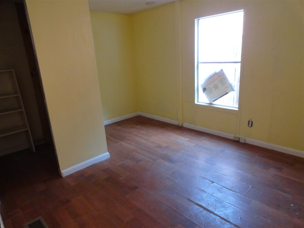 1340 Kings Estate Road St. Augustine, FL 32086 - Photo 31 of 40 an empty room with wooden floor and windows