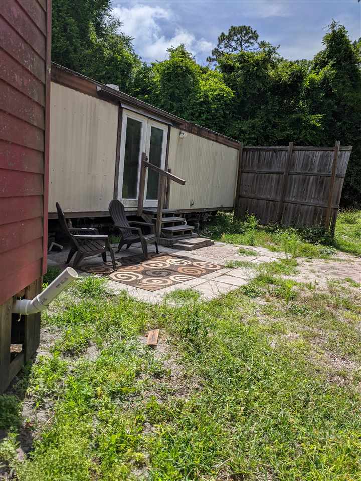1340 Kings Estate Road St. Augustine, FL 32086 - Photo 33 of 40 a view of a backyard with wooden fence