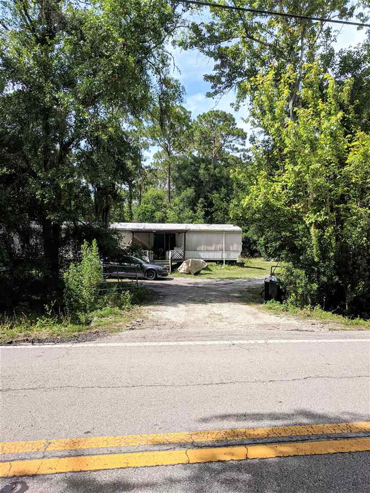 1340 Kings Estate Road St. Augustine, FL 32086 - Photo 39 of 40 a view of a house with a yard