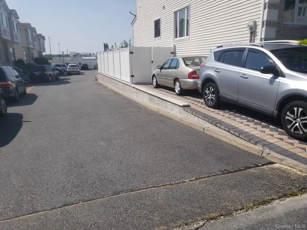 a view of a street in back of a house