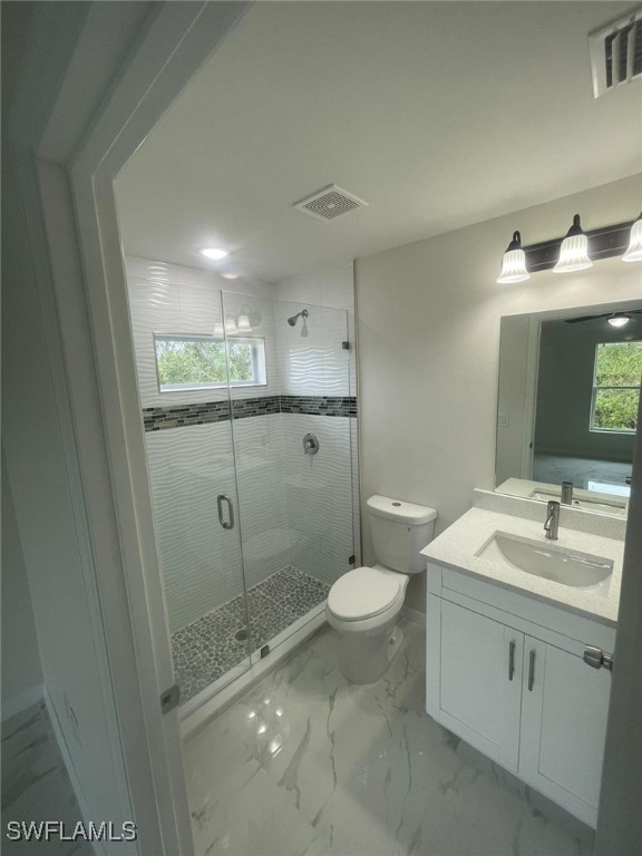 4524-4526 15th Street Southwest Lehigh Acres, FL 33973 - Photo 22 of 27 a bathroom with a sink toilet and shower
