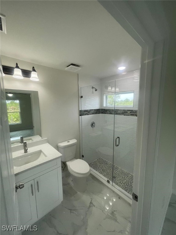 4524-4526 15th Street Southwest Lehigh Acres, FL 33973 - Photo 23 of 27 a bathroom with a toilet sink and shower