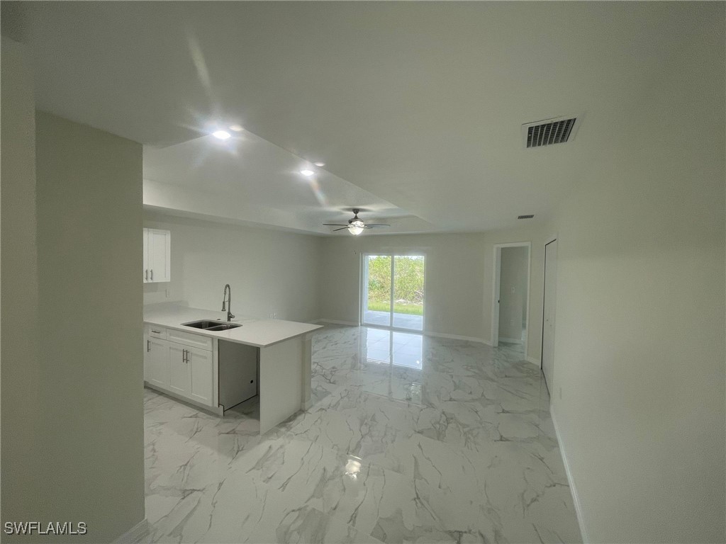 4524-4526 15th Street Southwest Lehigh Acres, FL 33973 - Photo 5 of 27 a view of a kitchen cabinets and a window