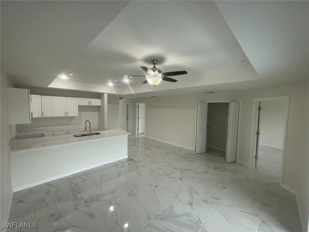 4524-4526 15th Street Southwest Lehigh Acres, FL 33973 - Photo 7 of 27 view of a kitchen with a sink stainless steel appliances and cabinets
