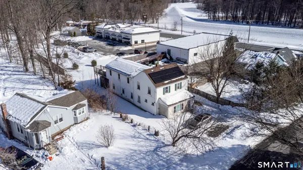 a view of a patio with wooden fence
