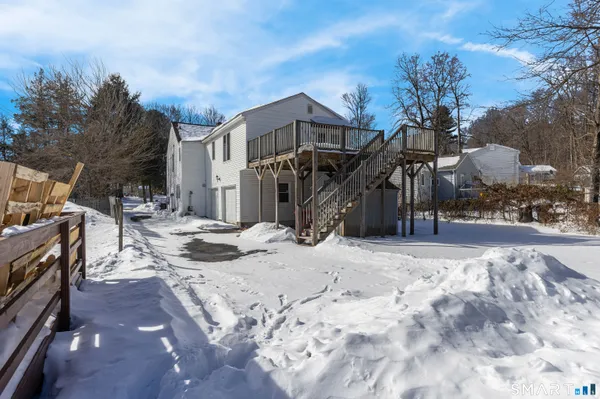 a view of a house with a snow on the road