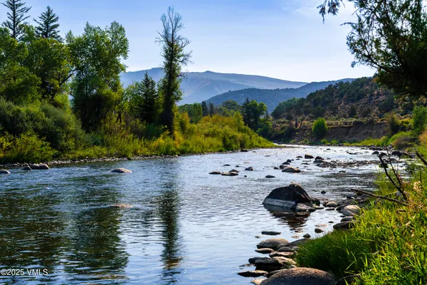 a view of a lake with an ocean