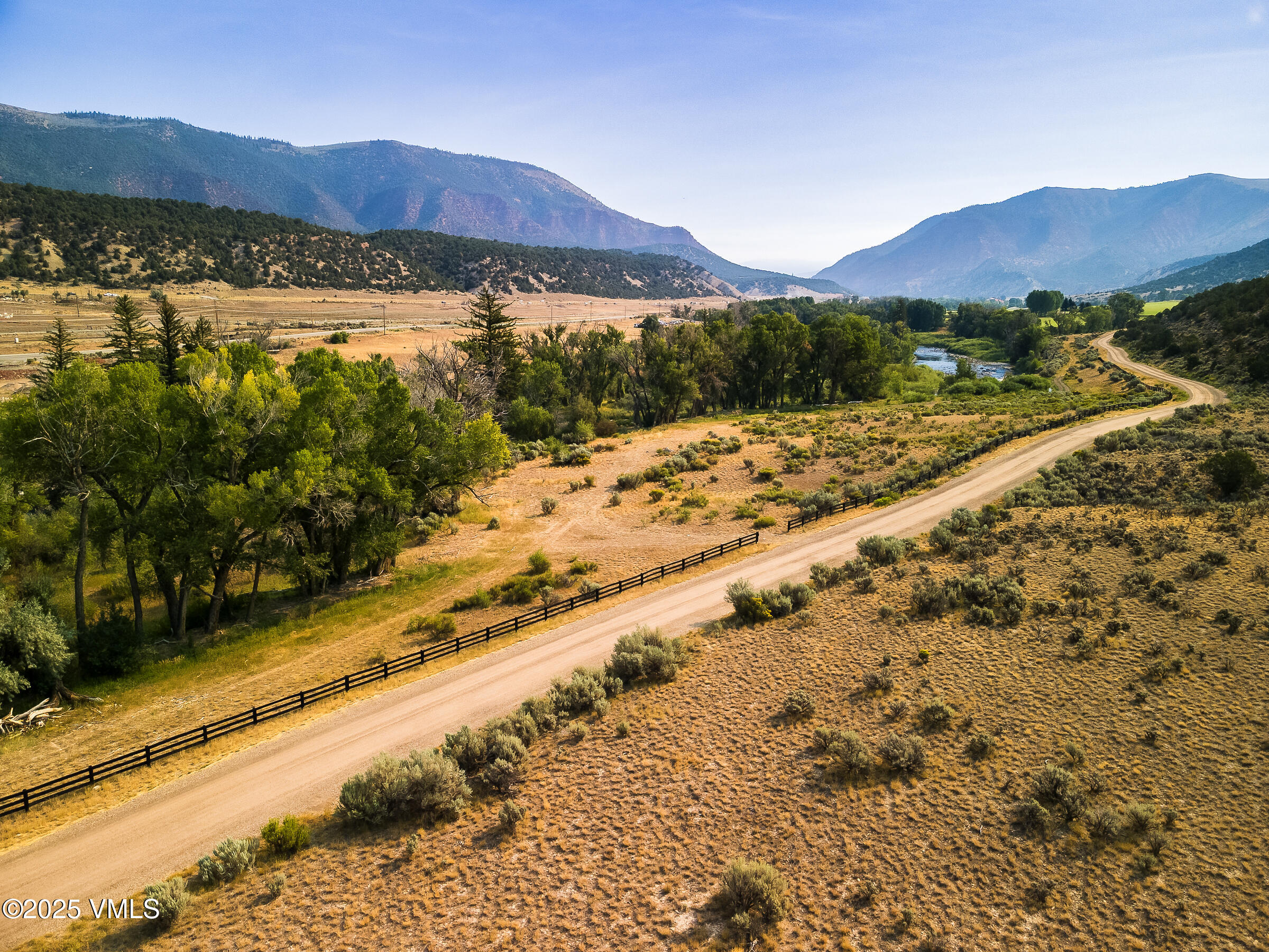 1633 West Diamond Star Road Eagle, CO 81631 - Photo 21 of 32 a view of a backyard with a lake