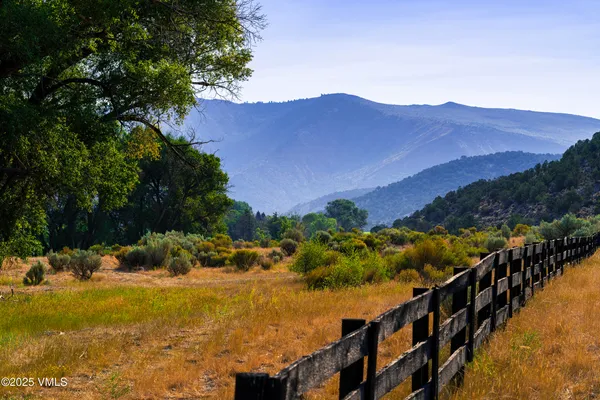 a view of a houses with mountains and a mountain