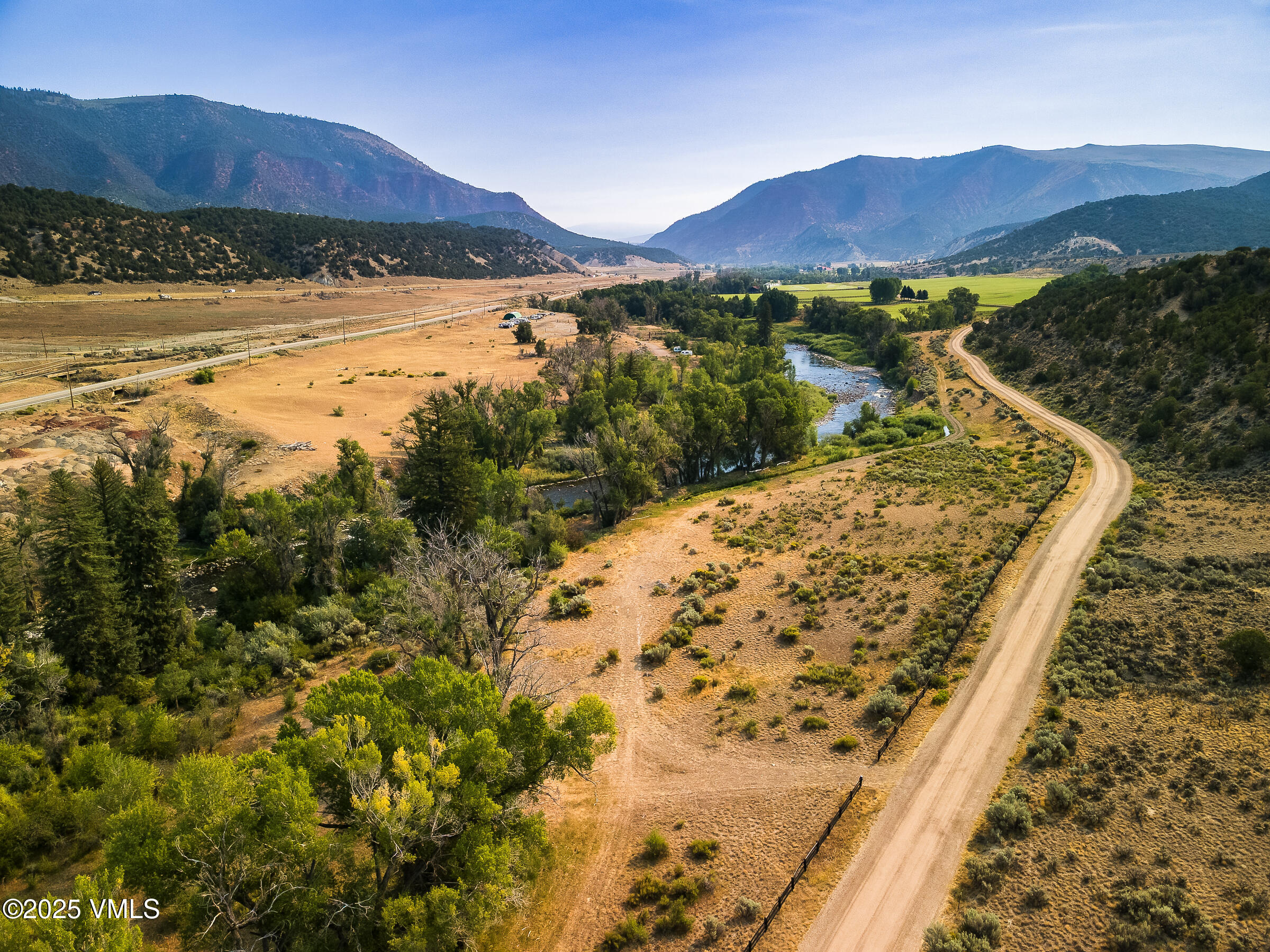 1633 West Diamond Star Road Eagle, CO 81631 - Photo 23 of 32 a view of a backyard with a lake view