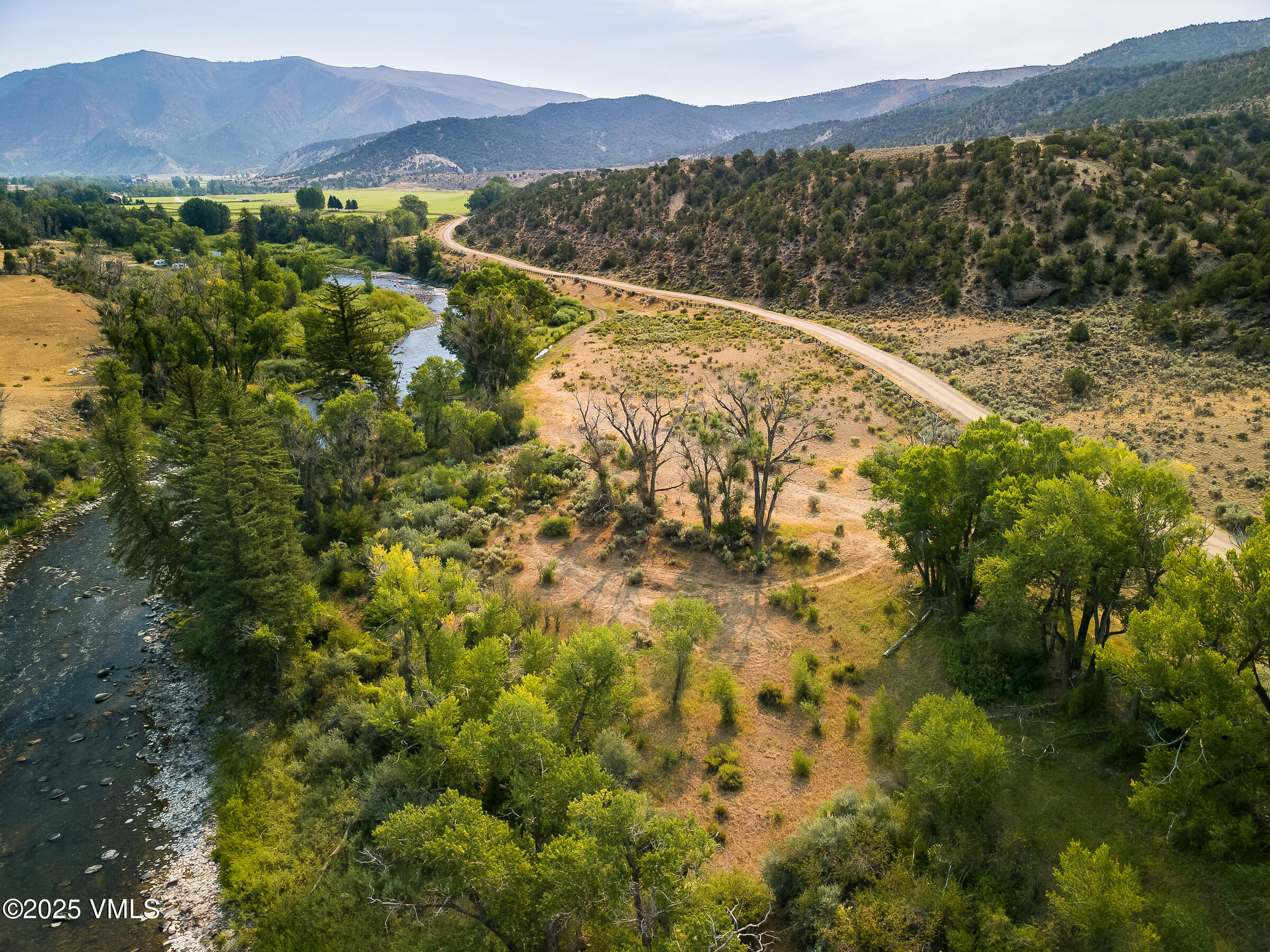 1633 West Diamond Star Road Eagle, CO 81631 - Photo 24 of 32 a view of a lake with mountains in the background