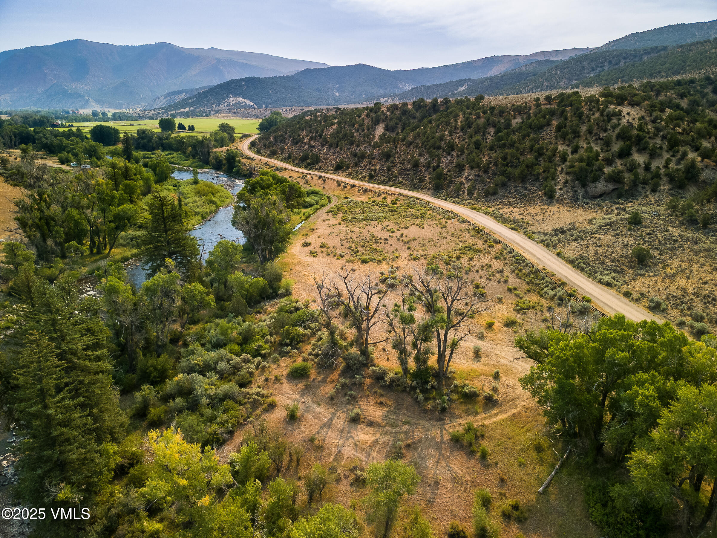 1633 West Diamond Star Road Eagle, CO 81631 - Photo 26 of 32 a view of a lake with mountains in the background