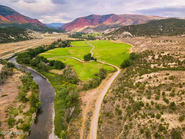 a view of an swimming pool and a mountain