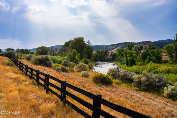 a view of a lake from a balcony