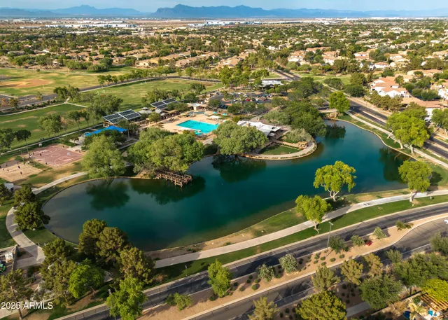 an aerial view of a house with a lake view