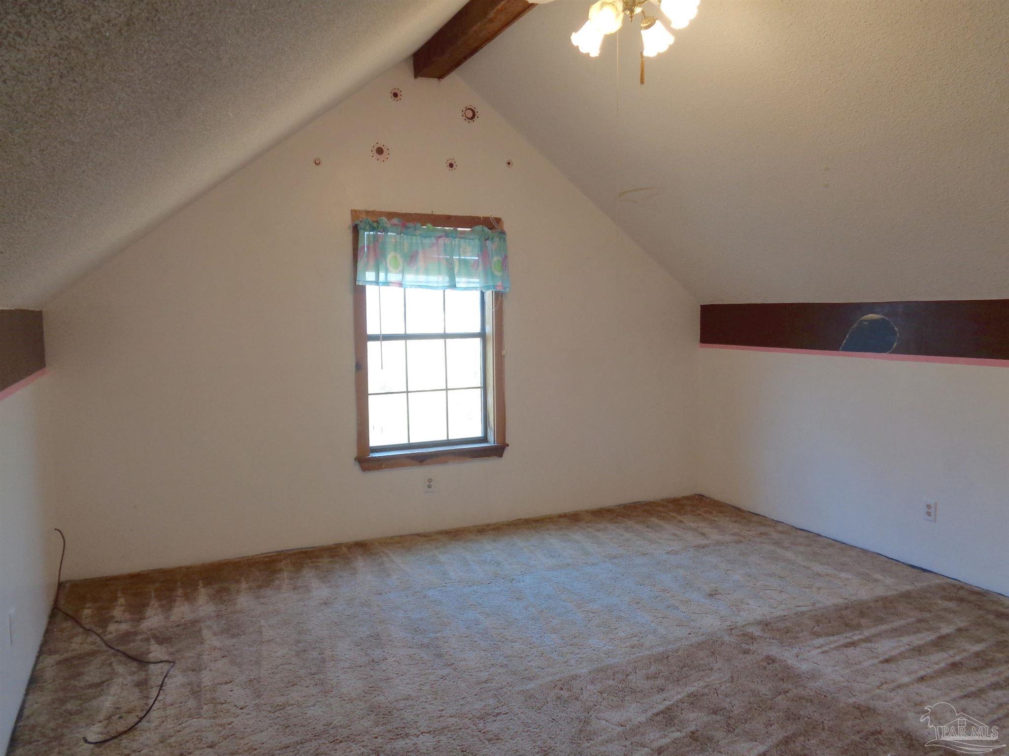 252 S Road Atmore, AL 36502 - Photo 13 of 40 an empty room with a window