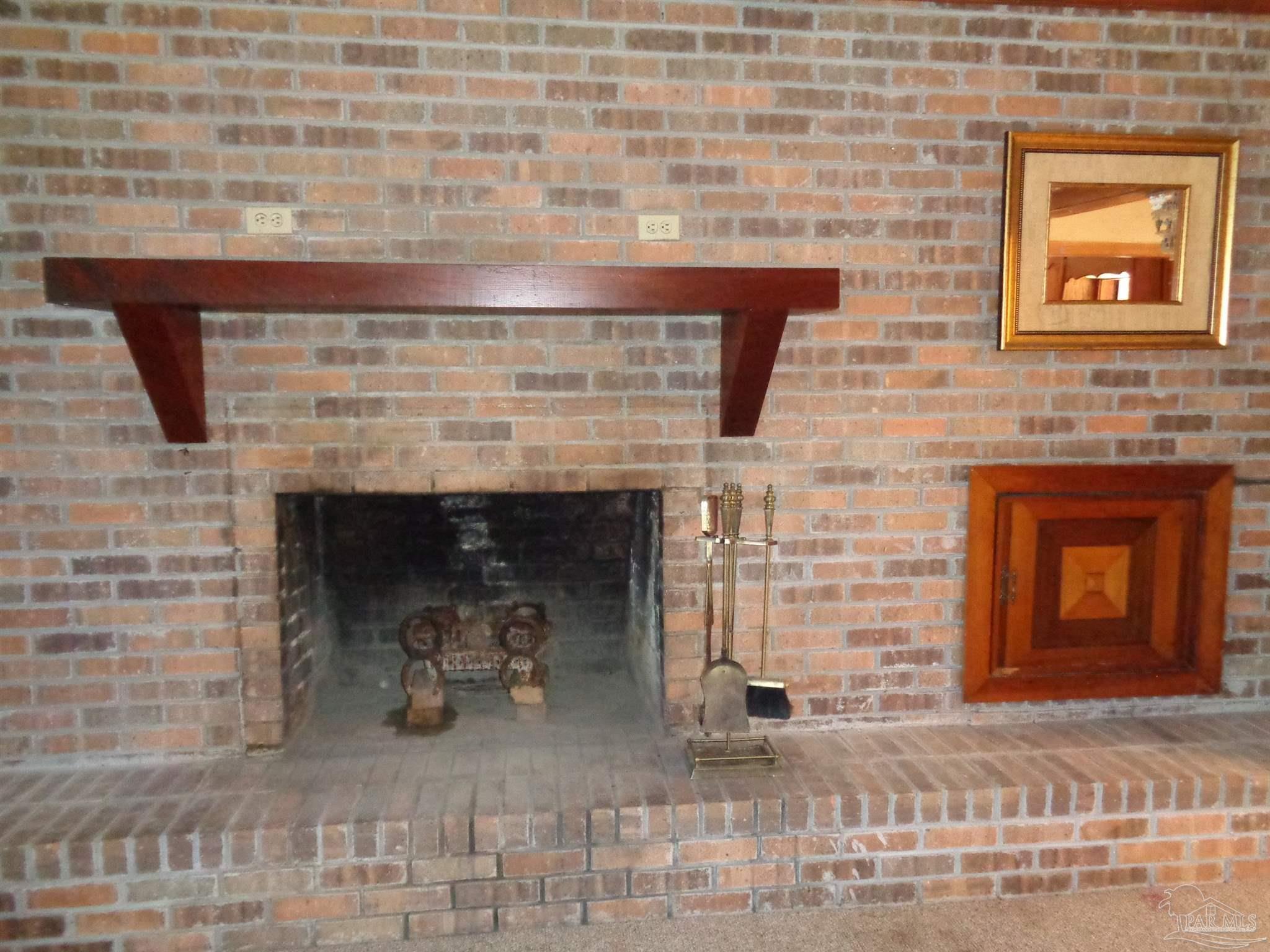 252 S Road Atmore, AL 36502 - Photo 21 of 40 a living room with a fireplace